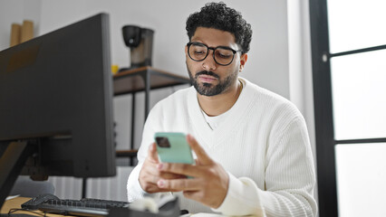 African american man business worker using computer and smartphone working at office