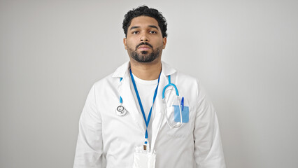 African american man doctor standing with serious expression over isolated white background