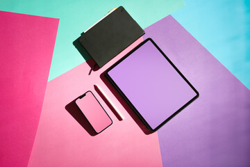 Creative smart devices with blank screens mockup. Smartphone and graphic tablet. Colorful...