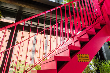 Pink iron staircase of a modern house.