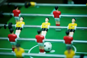 A board game of football. A miniature field. A game for two.