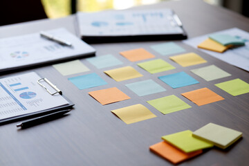 Document chart graph colored sticky notes It's on the table in the conference room