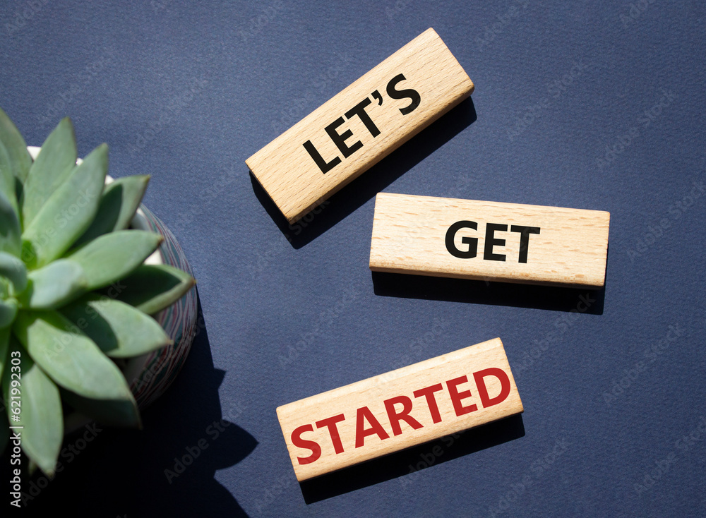 Canvas Prints lets get started symbol. concept words lets get started on wooden blocks. beautiful deep blue backgr