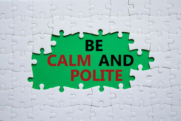 Be Calm and Polite symbol. Concept words Be Calm and Polite on white puzzle. Beautiful green background. Business and Be Calm and Polite concept. Copy space