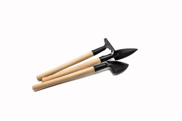 Wooden Gardening tools, shovel, rake on white background