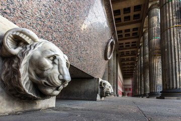 Ground level view of lion sculptures outside the entrance to the Altes Museum in Berlin.