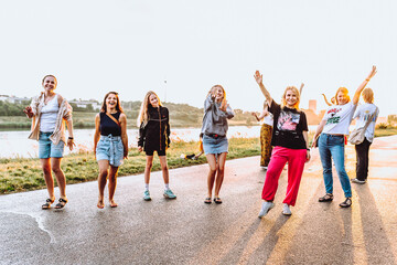 Obraz premium dancing cheerful attractive women at sunset. 