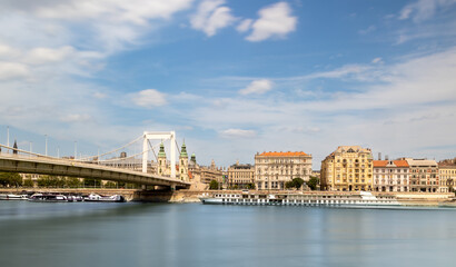 Fototapeta na wymiar Elisabeth Bridge, Erzsebet hid, across Danube river in Budapest, Hungary. Blue water and blue sky