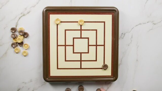 Playing Nine Men Morris Board Game top view