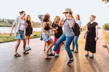 Obraz premium dancing cheerful attractive women at sunset. 