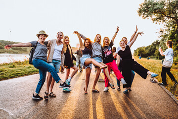 Obraz premium dancing cheerful attractive women at sunset. 