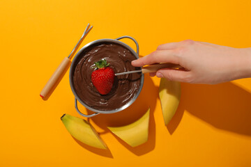 Concept of tasty and sweet food - chocolate fondue