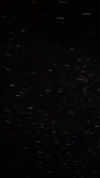 Vertical video. Flying dust cinematic animation background