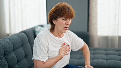 Middle age woman suffering heart pain home