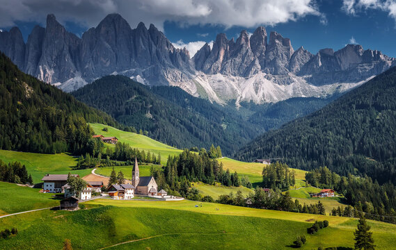 Incredible sunny landscape of Dolomites Alps. Popular view on world famous autumn alpine view in Dolomites alps. SANTA MADDALENA, ITALY. Iconic location for landscape photographers
