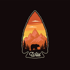 Wild bear, mountain and pine trees inside and arrowhead