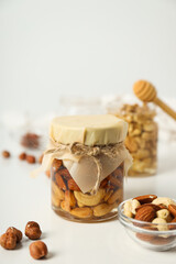 Concept of tasty and sweet food - honey with nuts