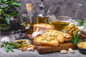 Bruschetta with olive oil, olives, pesto, garlic and parmesan. ciabatta bread with olive oil and spices. Delicacy. Delicious and healthy food. Vegan. Place to copy. copy space.