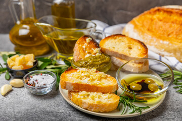 Bruschetta with olive oil, olives, pesto, garlic and parmesan. ciabatta bread with olive oil and spices. Delicacy. Delicious and healthy food. Vegan. Place to copy. copy space.