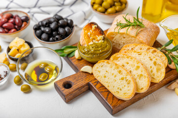 Bruschetta with olive oil, olives, pesto, garlic and parmesan. ciabatta bread with olive oil and spices. Delicacy. Delicious and healthy food. Vegan. Place to copy. copy space.
