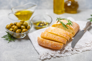 Bruschetta with olive oil, olives, pesto, garlic and parmesan. ciabatta bread with olive oil and spices. Delicacy. Delicious and healthy food. Vegan. Place to copy. copy space.