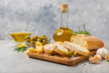 Bruschetta with olive oil, olives, pesto, garlic and parmesan. ciabatta bread with olive oil and spices. Delicacy. Delicious and healthy food. Vegan. Place to copy. copy space.