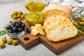 Bruschetta with olive oil, olives, pesto, garlic and parmesan. ciabatta bread with olive oil and spices. Delicacy. Delicious and healthy food. Vegan. Place to copy. copy space.