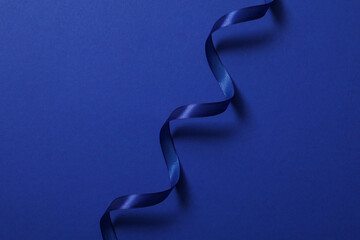 Concept of different ribbons, blue ribbon on blue background