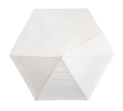 top view of hand-crafted from paper hexagonal pyramid three-dimensional geometric shape isolated on white background