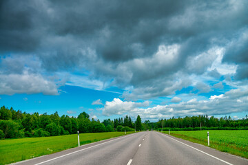 A road across the Estonia countryside, summer season