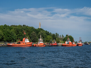 Port of Gdansk, Gdansk Poland, tugboats moored to the quay in the depths of the Monument to Obroncow Westerplatte	