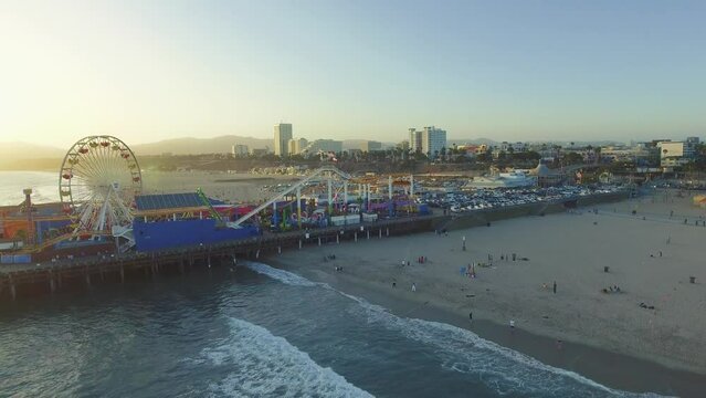 Aerial shot of Santa Monica Pier in California and the ocean during Sunset