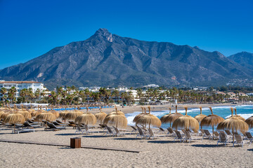 The beautiful beach of Puerto Banus in Marbella on a clear sunny day, Andalusia
