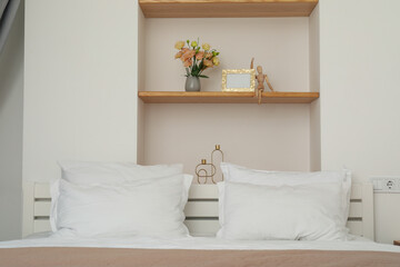 A beautiful bedroom in white colors with a bed