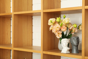 Wooden shelves on a white brick wall