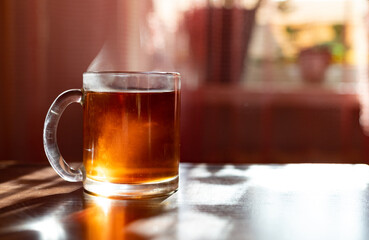 Hot black tea in transparent glass cup