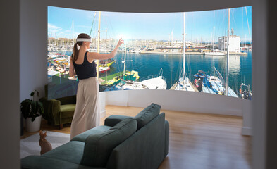 Woman Wearing VR Glasses Touching Screen With Yachts At Home