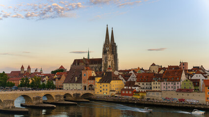 Historic church and bridge of Regensburg  on a summer evening