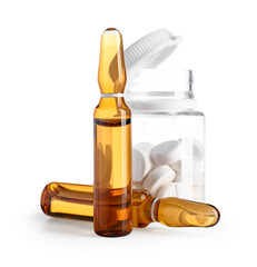 Ampules and bottle with pills on white background