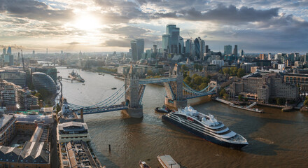 Large cruise ship going through London under the Tower Bridge. Visiting center of London. Tower...