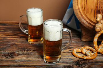 Mugs of cold beer on table. Oktoberfest celebration