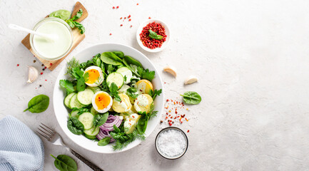 Green Buddha Bowl with Fresh Herbs and Vegetables, Healthy Balanced Meal, Bowl or Salad with Young Potatoes, Cucumber, Lettuce, Egg and Herb Dressing