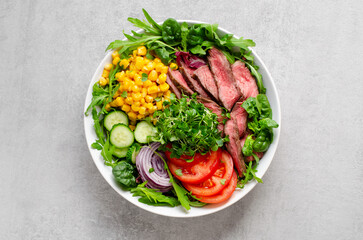Beef steak and Fresh Vegetables Buddha Bowl, Healthy Balanced Meal on Bright Background