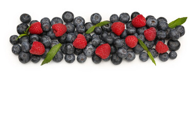 Ripe raspberry and blueberry on white background