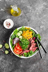Fototapeta na wymiar Beef steak and Fresh Vegetables Buddha Bowl, Healthy Balanced Meal on Dark Background