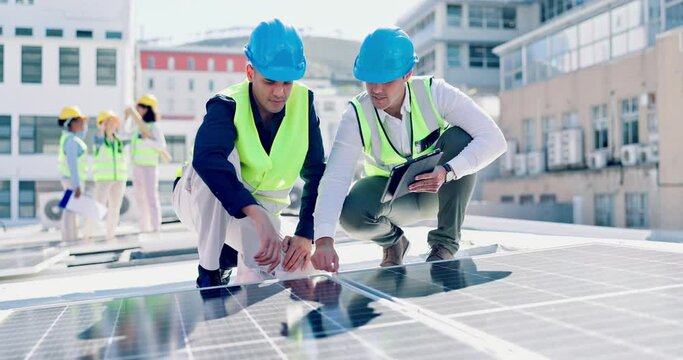 Solar panels, men and engineering discussion with tablet for planning city construction. Electrician, collaboration and team with digital technology at power grid, photovoltaic system and inspection