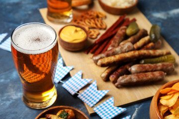 Glass of cold beer on blue background. Oktoberfest celebration