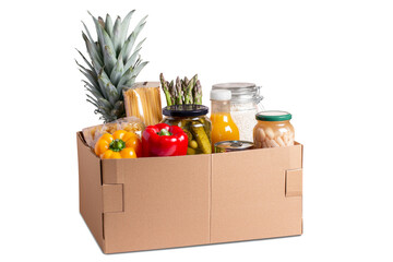 Isolated box with food for donation, charity concept. Canned food, pasta, fruits and vegetables in a box for donation isolated.