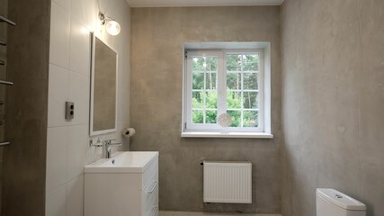 Shower cabin in the bathroom. Spacious and bright modern bathroom with shower. Interior of a luxury hotel bathroom with glass shower cabin. Modern Bathroom Design.