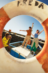 Friends having fun and posing on a boat during summer vacation in Cape Town © Faces of Travel